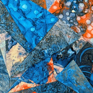 Dynamic abstract art with overlapping vibrant blue and orange geometric shapes creating a textured pattern.